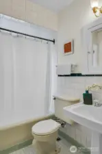 The bathroom is bright and super charming.
