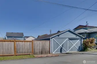 View of garage from alley. There is a double gate to the fence, making it easy to bring things into or out of the back yard.