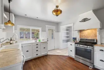 Country kitchen with fir floor, period lighting, walk-in pantry and door to the yard.