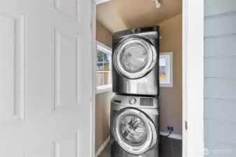 Full size washer and dryer in laundry room off back porch.