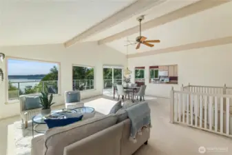 Great room is made for entertaining.  Stairs lead to the entry and then to the self-sufficient lower level of the home.