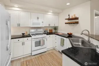 Open living room, dining room, kitchen- opening to private back patio & yard space