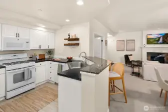 Open living room, dining room, kitchen- opening to private back patio & yard space