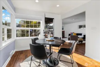 Dining room is nestled between kitchen, spacious deck and living room so everyone can gather and feel welcome.