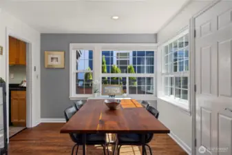 Large corner windows grace the dining room, and that door leads to the front patio which is the perfect spot for your morning coffee.