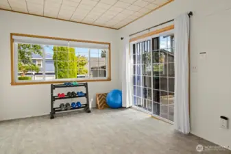This space is staged as a work out room, but could be an additional bedroom. Large sliding glass door leads to the private back patio which provides easy access to the two car garage and side yard.