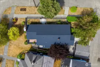 Big corner lot with parking galore, an attached 2 car garage off the alley
