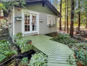 French Doors to front deck over bubbling pond