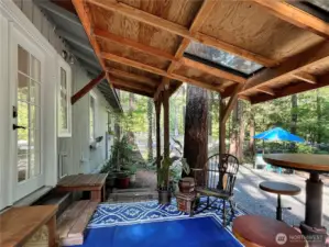 Bedroom opens to a charming deck, perfect for morning coffee or evening relaxation.