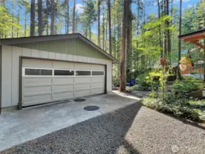 Spacious two-car garage with plenty of room for vehicles & storage.