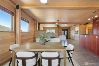 Dining Area, Breakfast Bar, Radiant Flooring through-out with Gas Fireplace & Living Room beyond! Great Room - Entry, Living, Dining & Kitchen - Cozy Gas Fireplace, Cedar interior & Radiant Tile Floors! Virtually staged to show the possibilities!