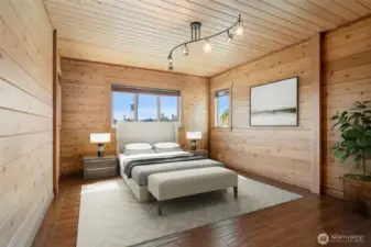 2nd Level Bedroom with radiant tile flooring, cozy cedar walls & ceilings plus views of Green Lake & City Lights! Virtually staged to show the possibilities!