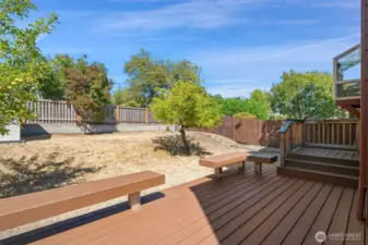 Backyard with newer deck off kitchen - fenced with small storage shed. Easy access from the house or the front yard.