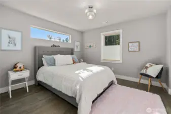 upstairs bedroom with a view of the trees