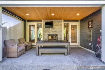 Back Patio with pool table/ping pong table/ dinner table, TV and a towel warmer for after a dip in the hot tub on a crisp fall evening!