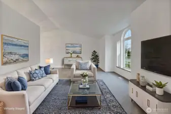 Formal living room with vaulted ceiling and large windows; image virtually staged.