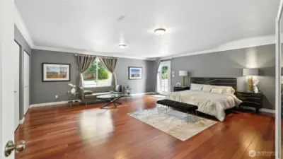 Oversized primary suite with French door entry.