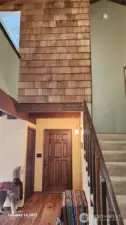 Stairwell to the upstairs.  Lots of use of wood in this home.