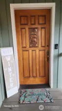 This beautiful hand carved front door welcomes you and your visitors.