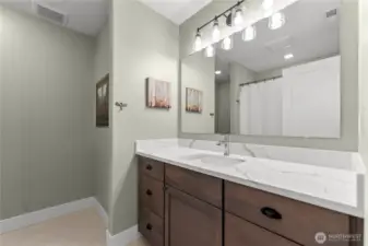 Clean and bright guest bathroom, centrally located near the secondary bedrooms.