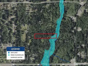 Overhead view with approximate boundaries in red and wetlands in blue.