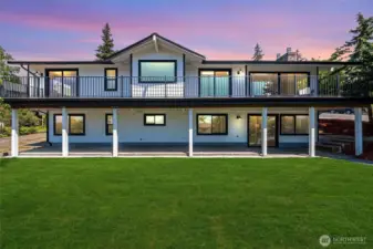 Soak in sweeping views from this beautifully updated home, featuring expansive decks, fresh landscaping, and a modern aesthetic that shines from every angle.