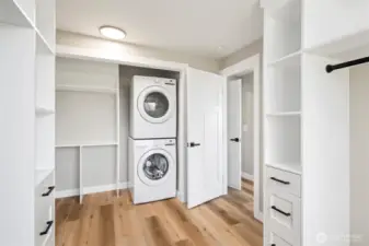 Convenient in-room laundry tucked inside the walk-in closet—streamlined function meets everyday luxury.