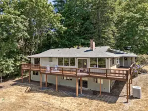 With direct access from the main living area, this deck makes outdoor living easy. There’s plenty of room for seating, grilling, or just enjoying the breeze off the water. Towering trees provide privacy and a constant connection to nature. It’s the kind of space that feels like a retreat without needing a vacation.