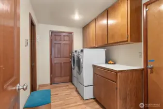Your mudroom offers dual access! Come in from outside after a day of gardening or from working in your garage or step inside after parking your vehicle in your attached 2 car garage. Either way, the mess stops here with the convenience of your laundry room to toss all your work wear into.