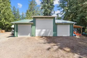 6 car garage with carport! A mechanic's dream with high bay door, power, heat & plumbed for an air compressor! There's plenty of room for all your vehicles, toys, work trucks & more! RV parking is effortless with a dump station & a circular driveway. You'll find additional shelter with the carport.