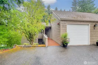 Park in front of garage plus extra parking spot to left of walkway.