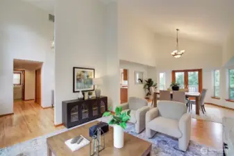 Main Level Grand Living and Dining Rooms with Vaulted Ceilings