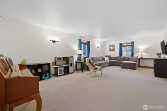 This spacious room is quite flexible--designed as a combined dining room and living room area, it can also be used as one large room depending on your needs/preferences.