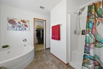 Around this privacy wall is the commode, with walk-in-closet seen ahead--larger than you'd expect!