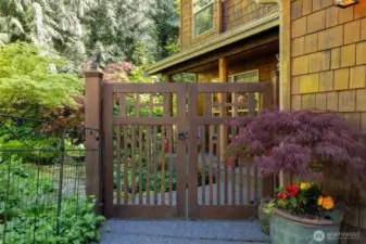 The front yard is fully fenced and there is a lovely gate to enter off the driveway...let's take a look!
