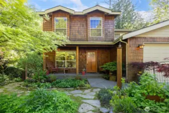 Looking at the front of this very sweet home that is surrounded by incredible landscaping and has been so loved by this one single owner.