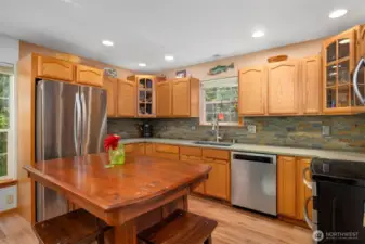 Another view showing how large the kitchen is, as well as how light and bright it is like the rest of the home.