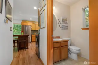 The half bath and laundry room is conveniently placed between the kitchen and the family room.