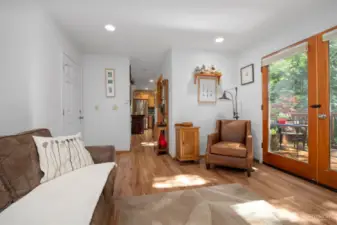 Looking across the family room toward the kitchen. The door to the left opens into the attached 2-car garage.