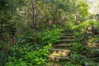Another view of the stone stairway that leads down on both sides of the home.