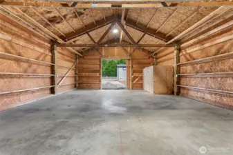 Inside view of the garage/shop, pump for well is housed in the little room to the right.