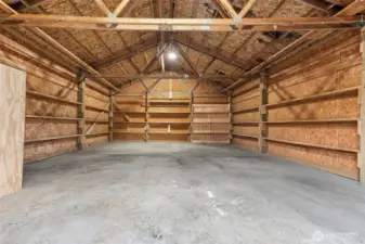 View of back side of the garage/shop.  Doors lead to back of property.