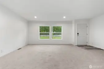 Upon entering the home you have canned lighting, plus two large windows allowing so much light into the spacious living room.