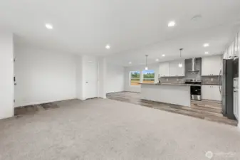 View seeing entire living, dining and kitchen.