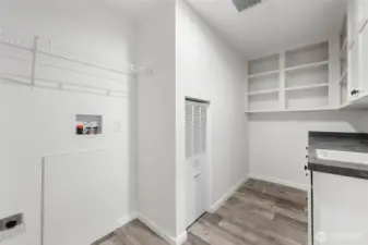 Furnace, hot water heater, electrical panel and washer/dryer hook-up all in the utility space.