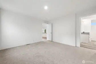 View looking back to living area and to the right is the primary bath.