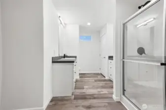Large primary bath with separate his/her sinks and a walk-in shower.