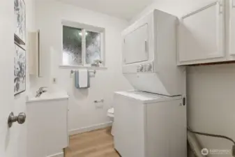 Lower level laundry room with half-bath