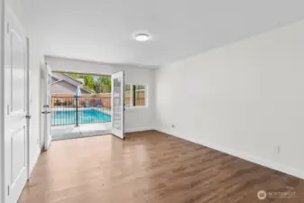 Bedroom #3, with french doors opening to pool area