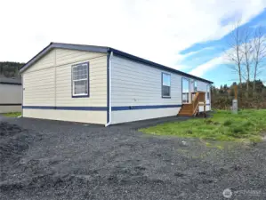 Fresh exterior paint and welcoming updates including, skirting, decks and parking area set the tone for this move-in ready home in Country Life Estates.